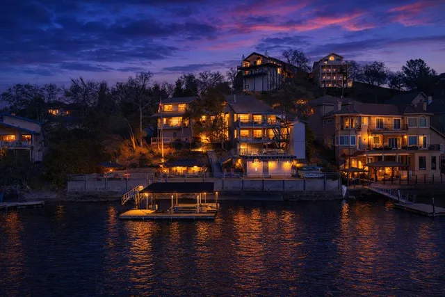 a kitchen with a table chairs and flat screen tv