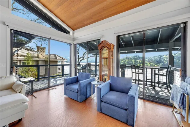 a living room with furniture a rug and a window
