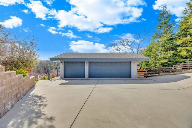 a kitchen with stainless steel appliances granite countertop a refrigerator a sink and a stove