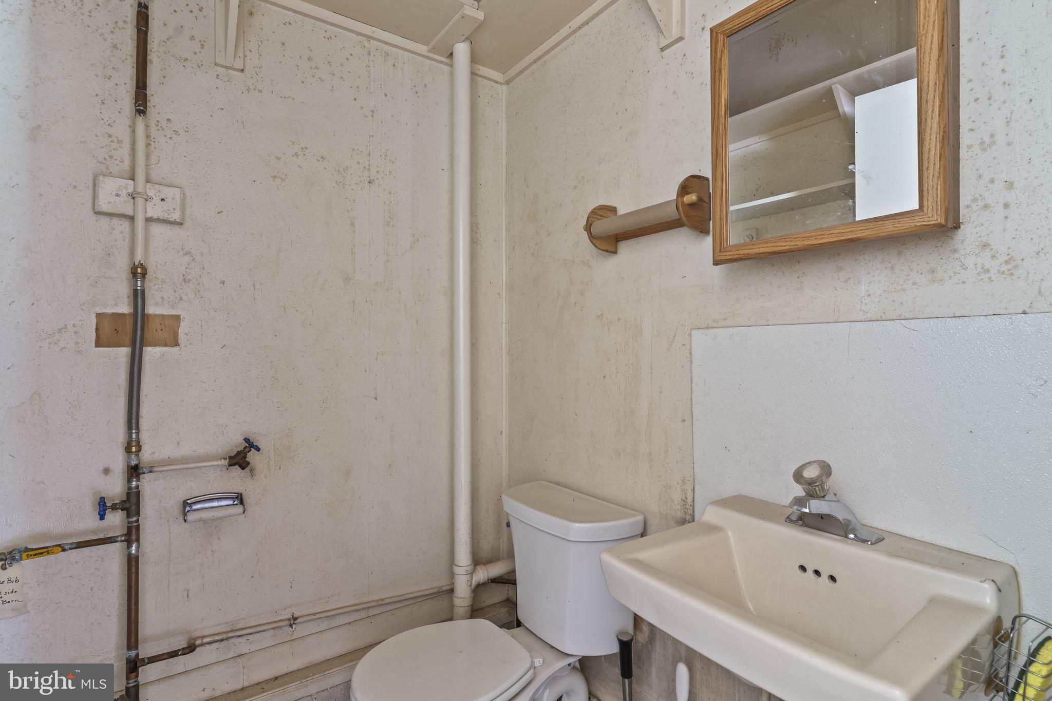 1800 Holland Cliffs Road Huntingtown, MD 20639 - Photo 64 of 70 1/2 bath in barn/garage