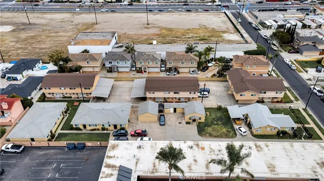 an aerial view of residential houses with outdoor space