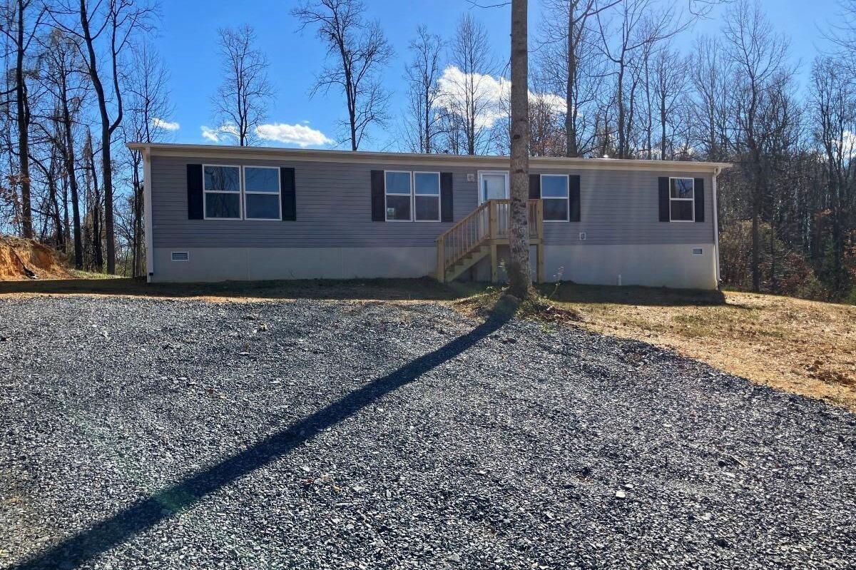 5489 Forge Road Glasgow, VA 24555 - Photo 23 of 38 a view of a house with a yard