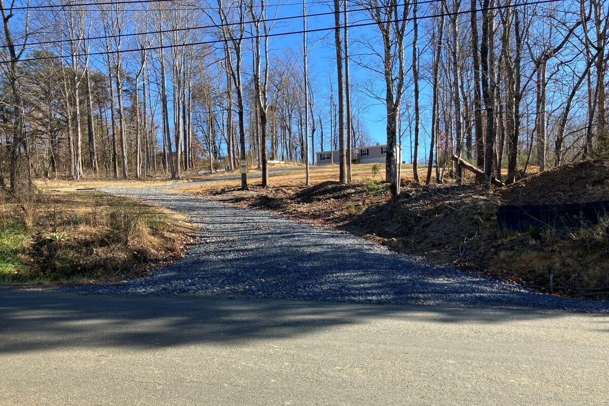 5489 Forge Road Glasgow, VA 24555 - Photo 32 of 38 a view of a backyard with a patio