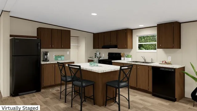 a kitchen with granite countertop a refrigerator and a stove top oven