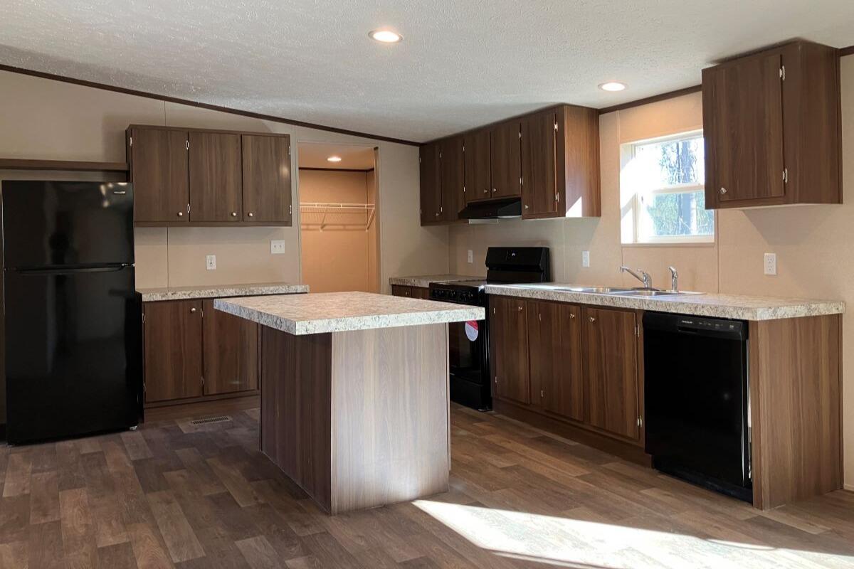 5489 Forge Road Glasgow, VA 24555 - Photo 6 of 38 a kitchen with a sink stove and refrigerator