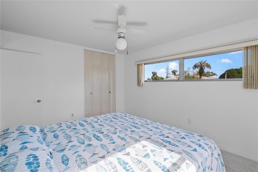 10609 Raffia Drive Port Richey, FL 34668 - Photo 15 of 24 a bedroom with a bed and a window