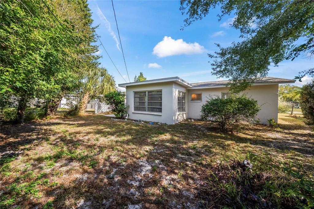 10609 Raffia Drive Port Richey, FL 34668 - Photo 21 of 24 a view of a house with a tree
