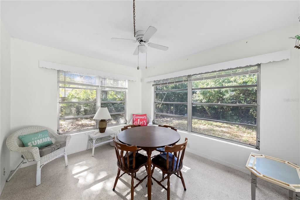 10609 Raffia Drive Port Richey, FL 34668 - Photo 10 of 24 a view of a dining room with furniture window and outside view