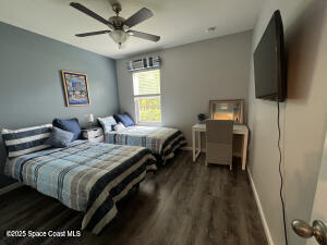 1015 Swiss Pointe Lane Rockledge, FL 32955 - Photo 12 of 26 a bedroom with bed tv and window