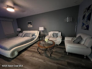 1015 Swiss Pointe Lane Rockledge, FL 32955 - Photo 15 of 26 a living room with furniture and a rug