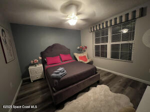 1015 Swiss Pointe Lane Rockledge, FL 32955 - Photo 18 of 26 a bedroom with furniture and a window