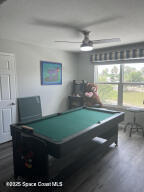 1015 Swiss Pointe Lane Rockledge, FL 32955 - Photo 20 of 26 a room with pool table and windows