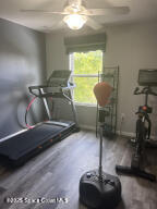 1015 Swiss Pointe Lane Rockledge, FL 32955 - Photo 21 of 26 a room with gym equipment