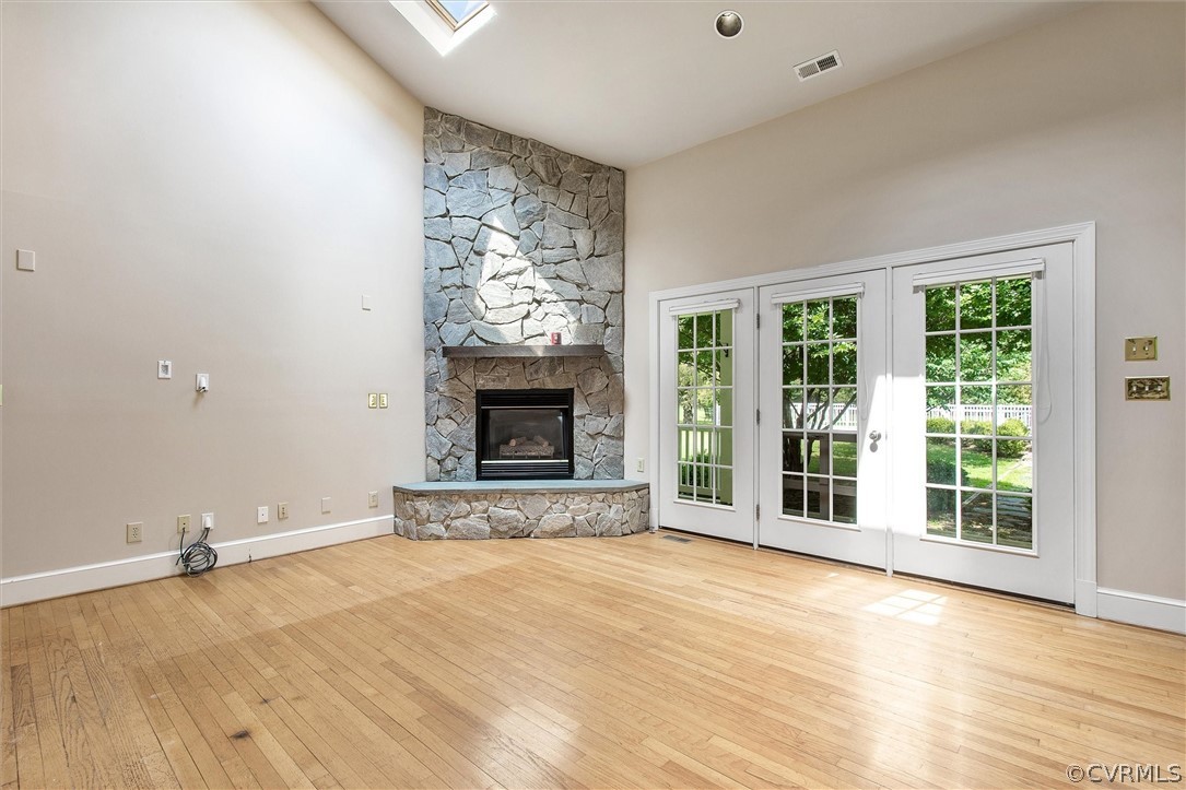 1711 Shallow Well Road Manakin-Sabot, VA 23103 - Photo 7 of 50 Gas Fireplace with Stone Surround and Vaulted Ceil