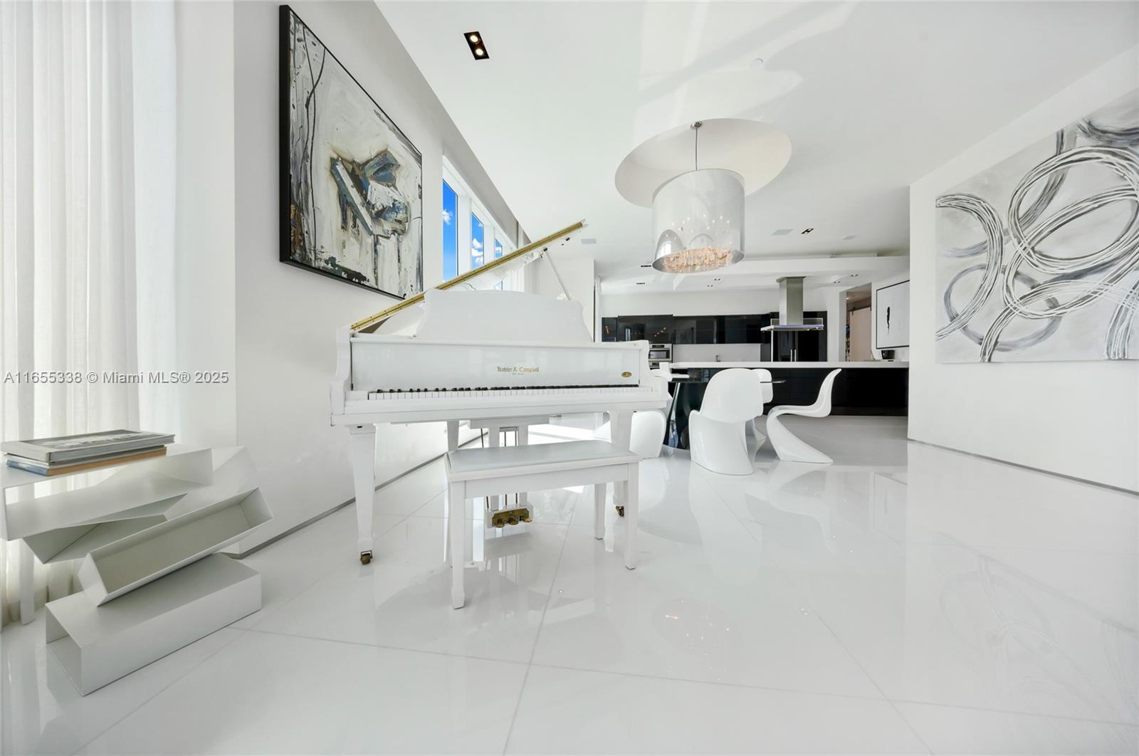 900 Brickell Key Boulevard, Unit 2603 Miami, FL 33131 - Photo 13 of 99 a living room with furniture and a chandelier