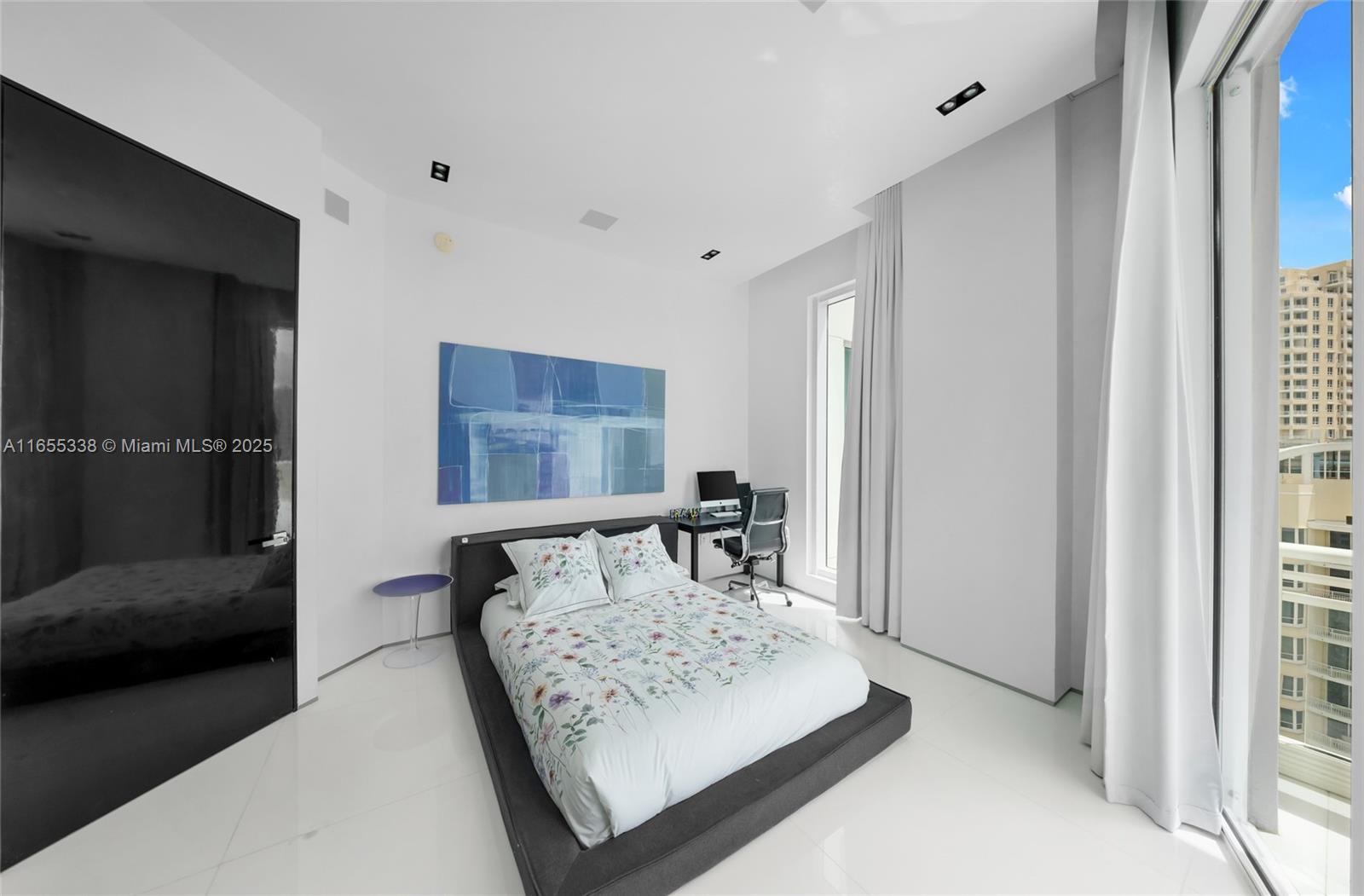 900 Brickell Key Boulevard, Unit 2603 Miami, FL 33131 - Photo 57 of 99 a living room with furniture and a window