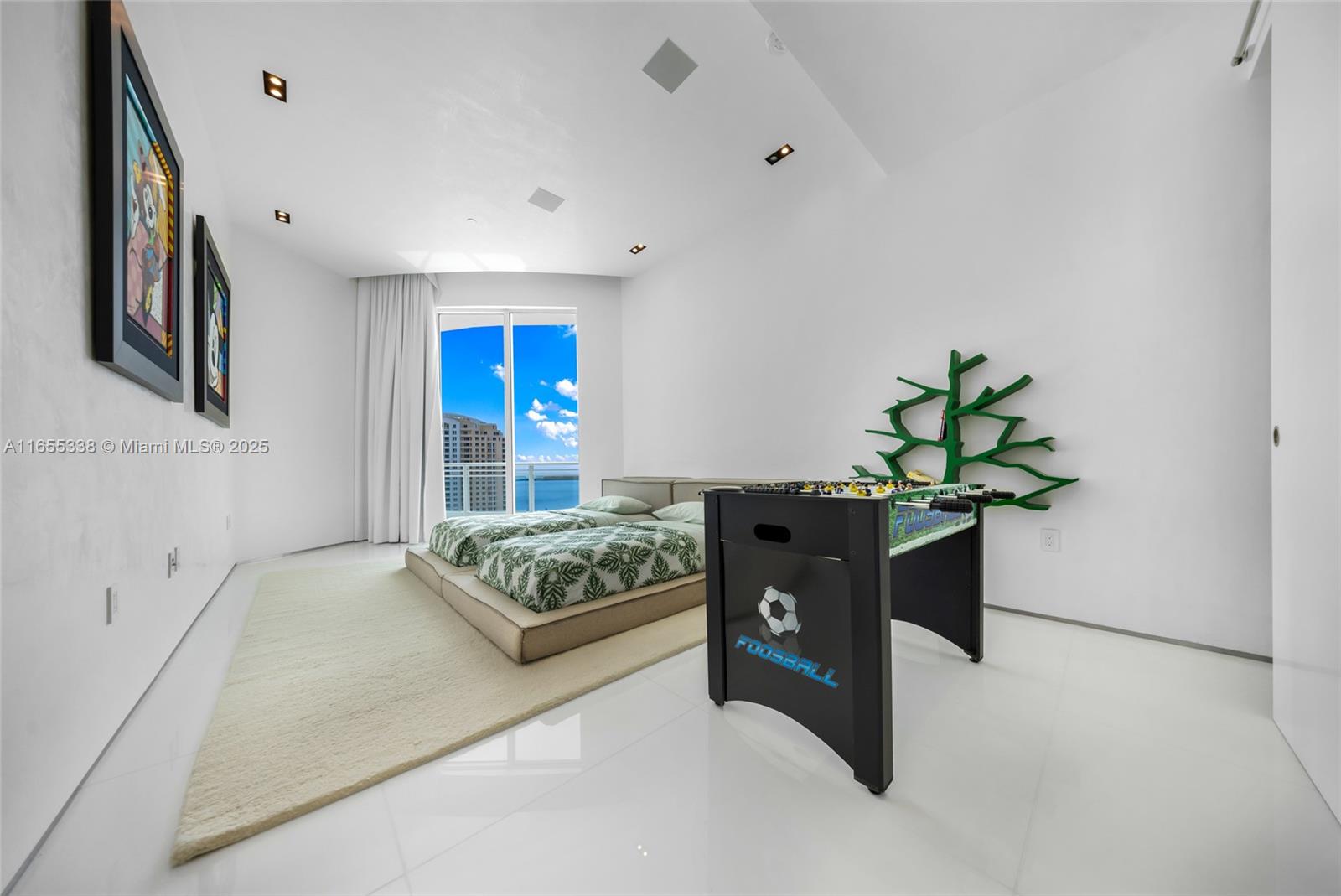 900 Brickell Key Boulevard, Unit 2603 Miami, FL 33131 - Photo 65 of 99 a bedroom with a bed and a potted plant