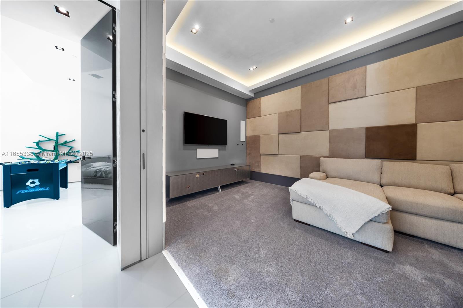 900 Brickell Key Boulevard, Unit 2603 Miami, FL 33131 - Photo 70 of 99 a living room with furniture and a flat screen tv