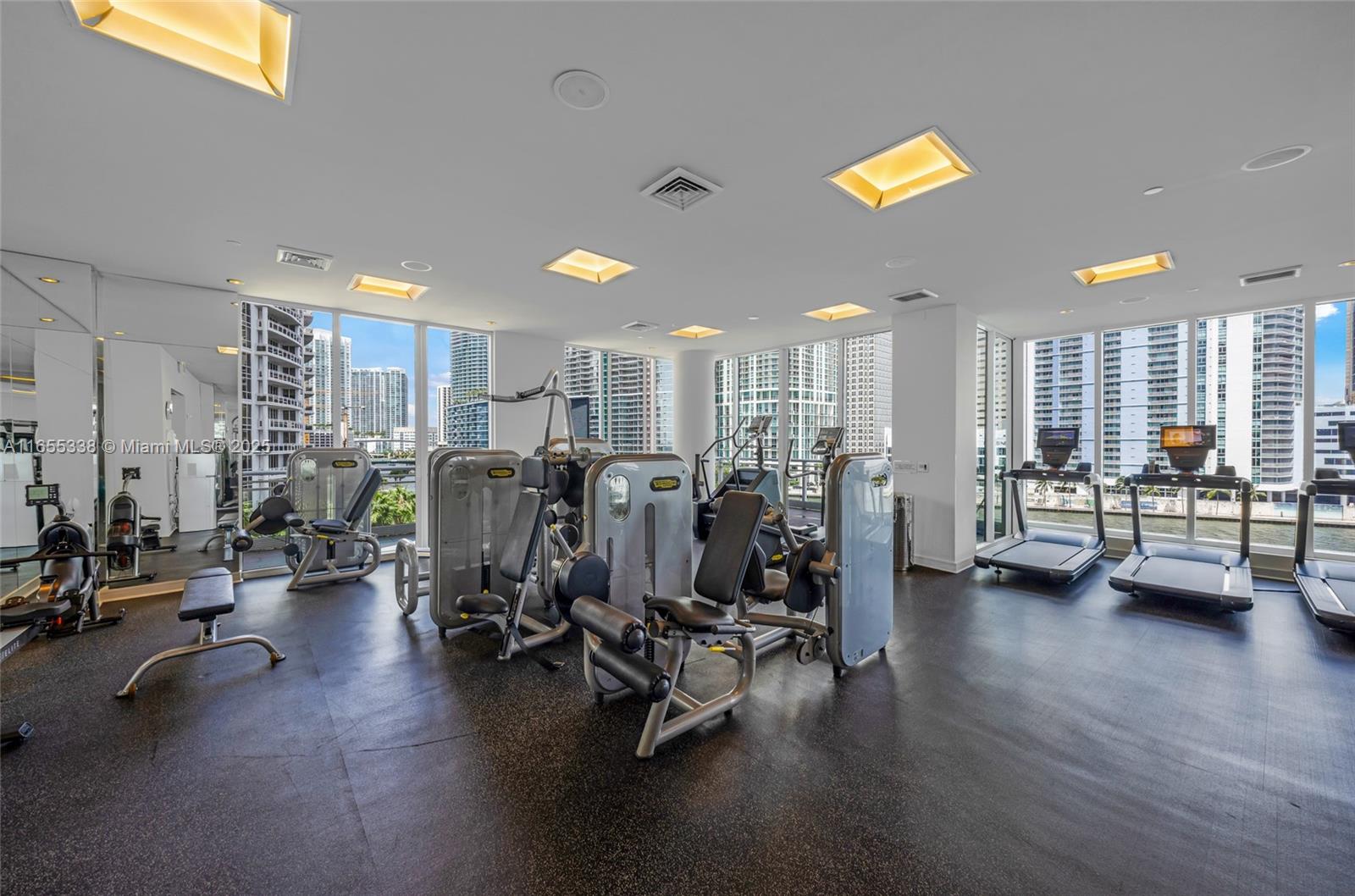 900 Brickell Key Boulevard, Unit 2603 Miami, FL 33131 - Photo 85 of 99 a view of a room with gym equipment