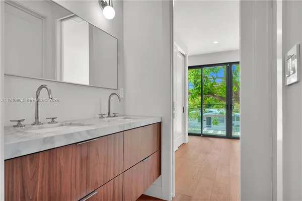 a bathroom with a sink and mirror