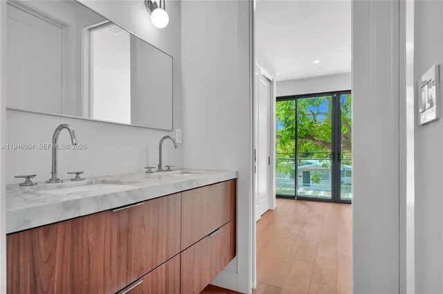 a bathroom with a sink and mirror