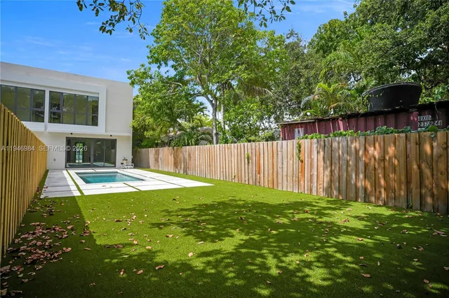 a view of a backyard with a small cabin
