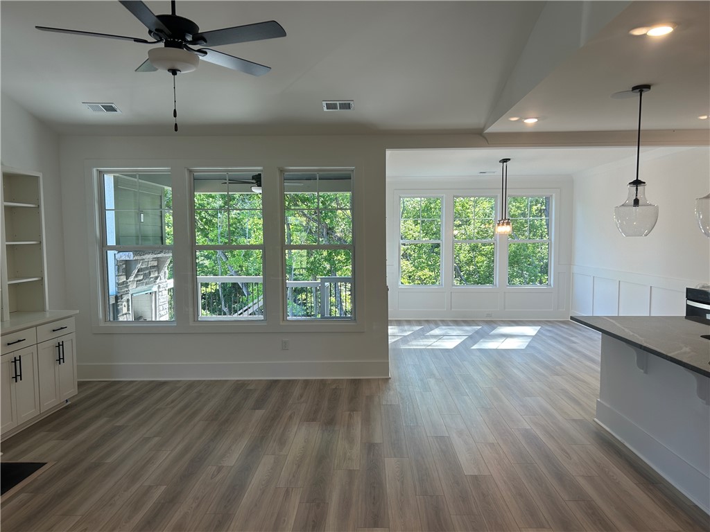 131 Shale Drive Central, SC 29630 - Photo 4 of 11 This airy open-concept space features expansive windows and durable flooring, perfect for contemporary living.