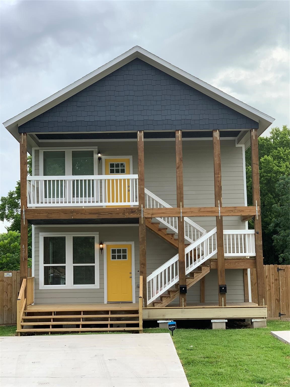 4221 Alvin Street, Unit A Houston, TX 77051 - Photo 1 of 15 a front view of a house with a yard