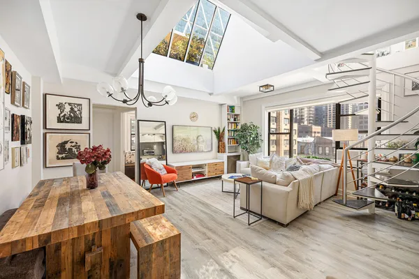 a living room with furniture and flat screen tv
