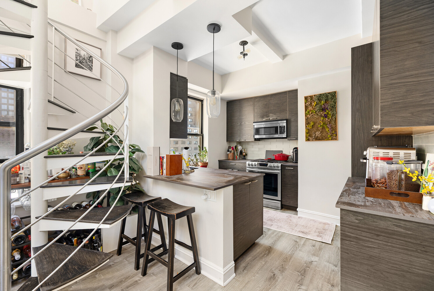 321 West 55th Street, Unit 93 Manhattan, NY 10019 - Photo 5 of 10 a view of a kitchen and dining room
