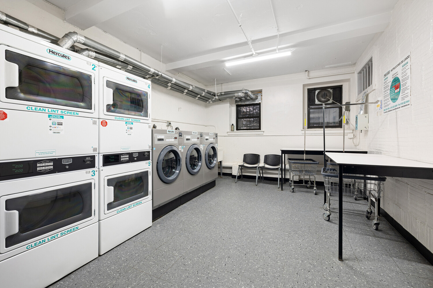 321 West 55th Street, Unit 93 Manhattan, NY 10019 - Photo 10 of 10 a utility room with dryer and washer