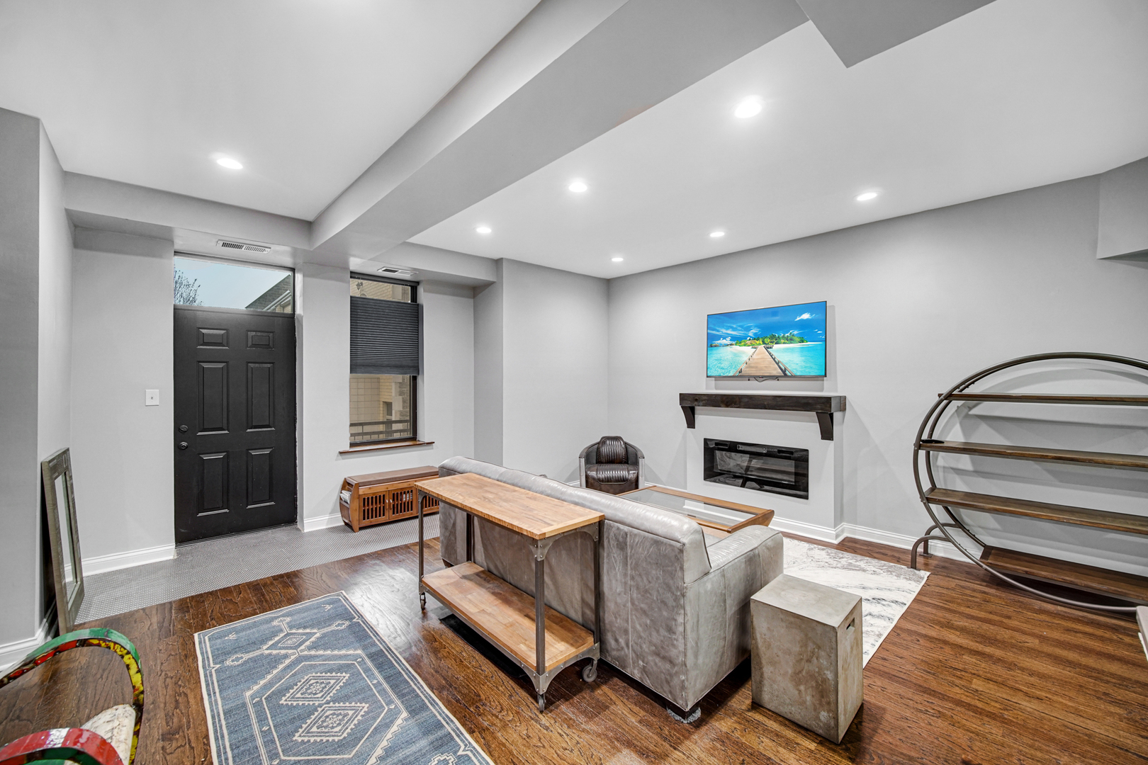 Undisclosed Address Chicago, IL 60615 - Photo 2 of 11 a living room with furniture and a flat screen tv