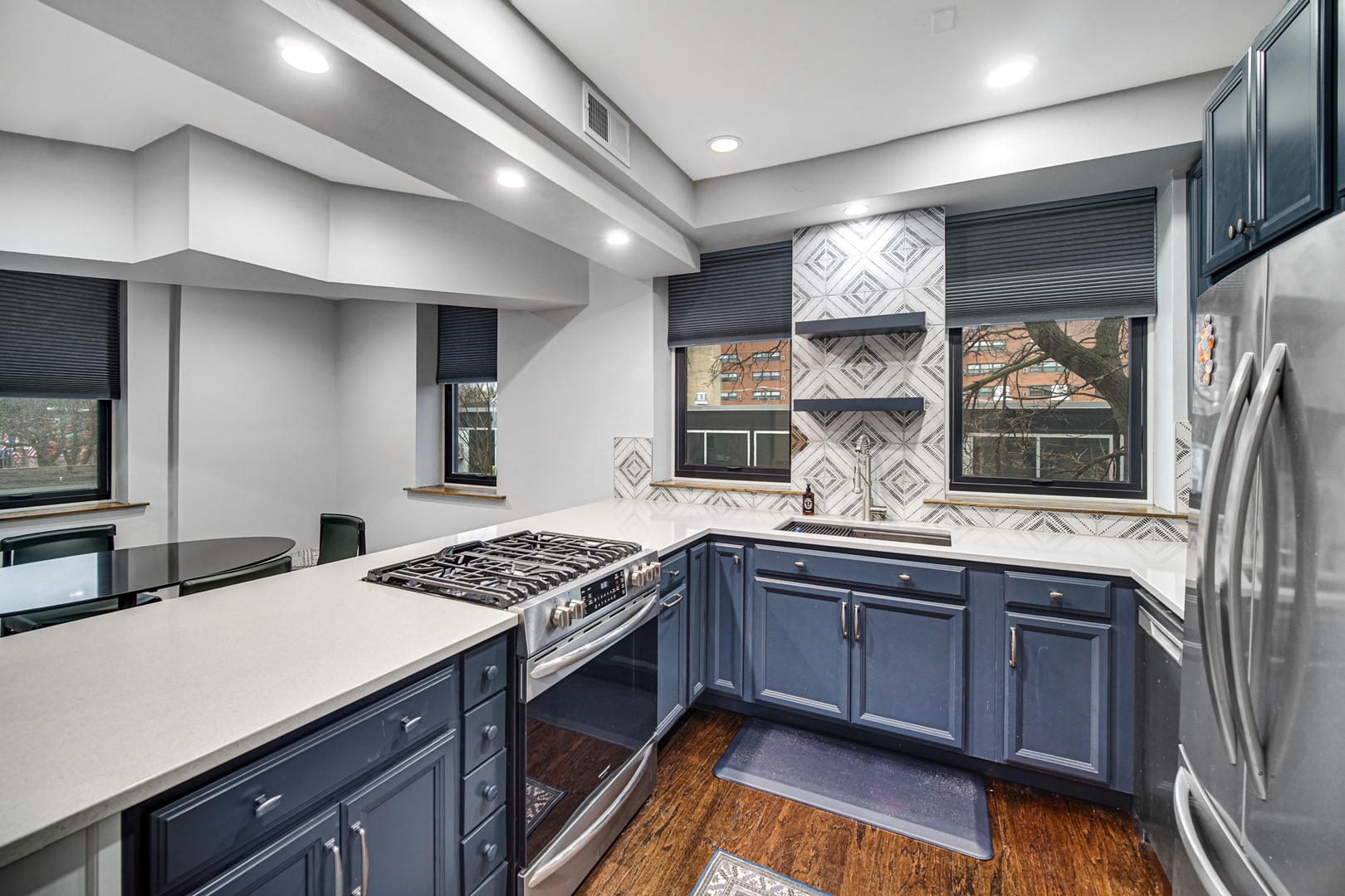 Undisclosed Address Chicago, IL 60615 - Photo 6 of 11 a kitchen with a sink stove and cabinets
