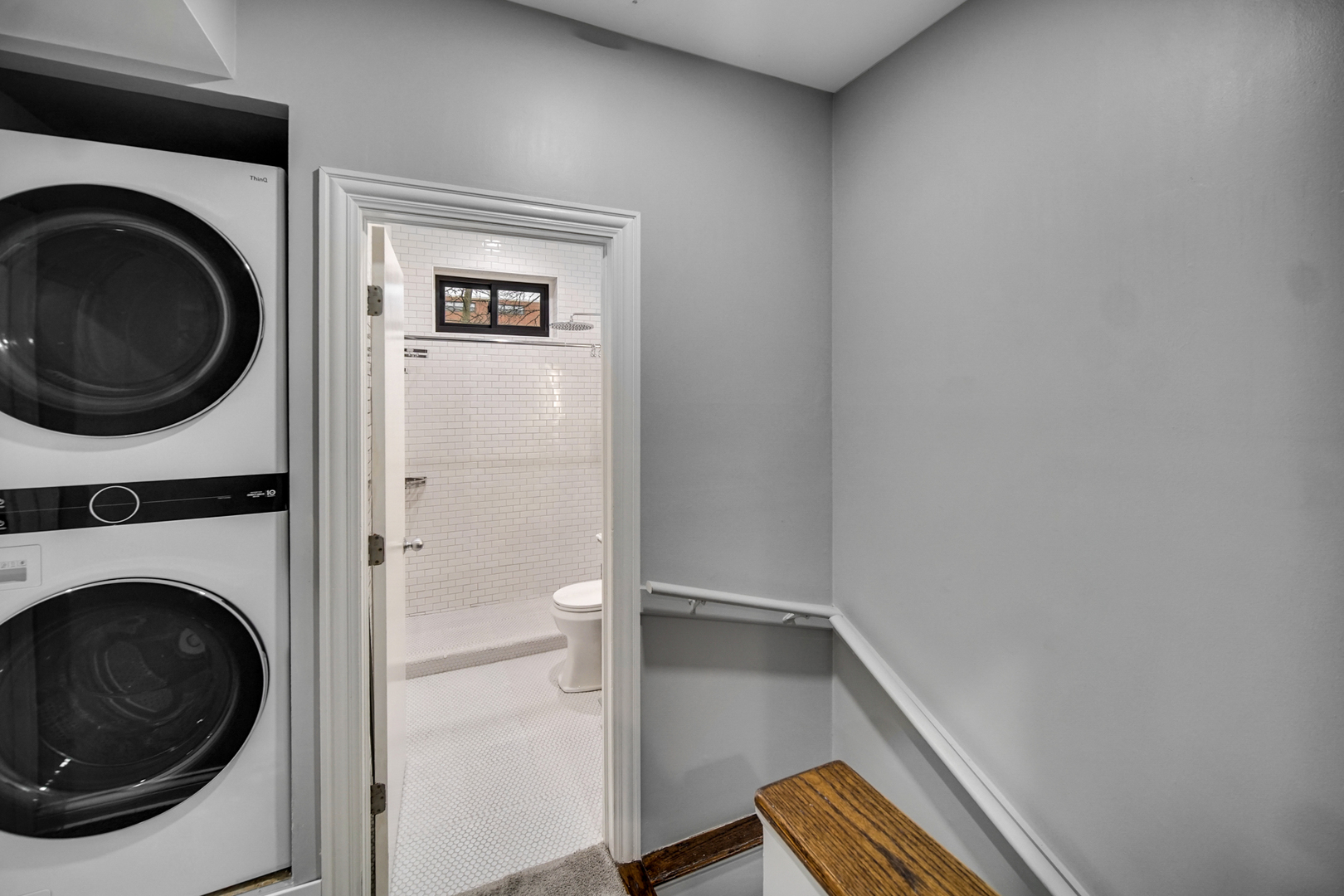 Undisclosed Address Chicago, IL 60615 - Photo 7 of 11 a view of a hallway with washer and dryer