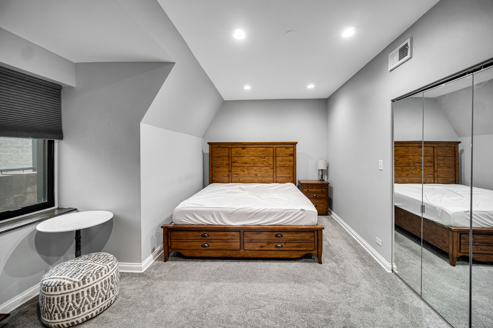 Undisclosed Address Chicago, IL 60615 - Photo 10 of 11 a bedroom with a bed and a television