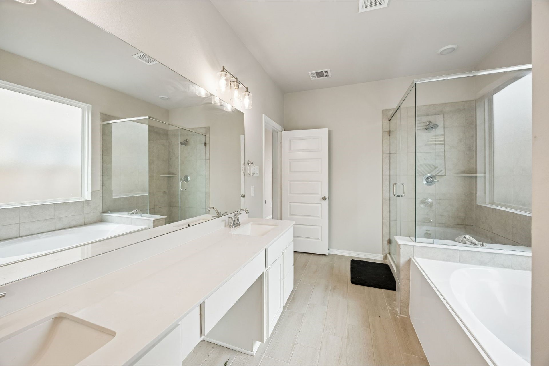 8103 Red Shiner Way Fulshear, TX 77441 - Photo 15 of 29 a spacious bathroom with a tub sink shower and a mirror