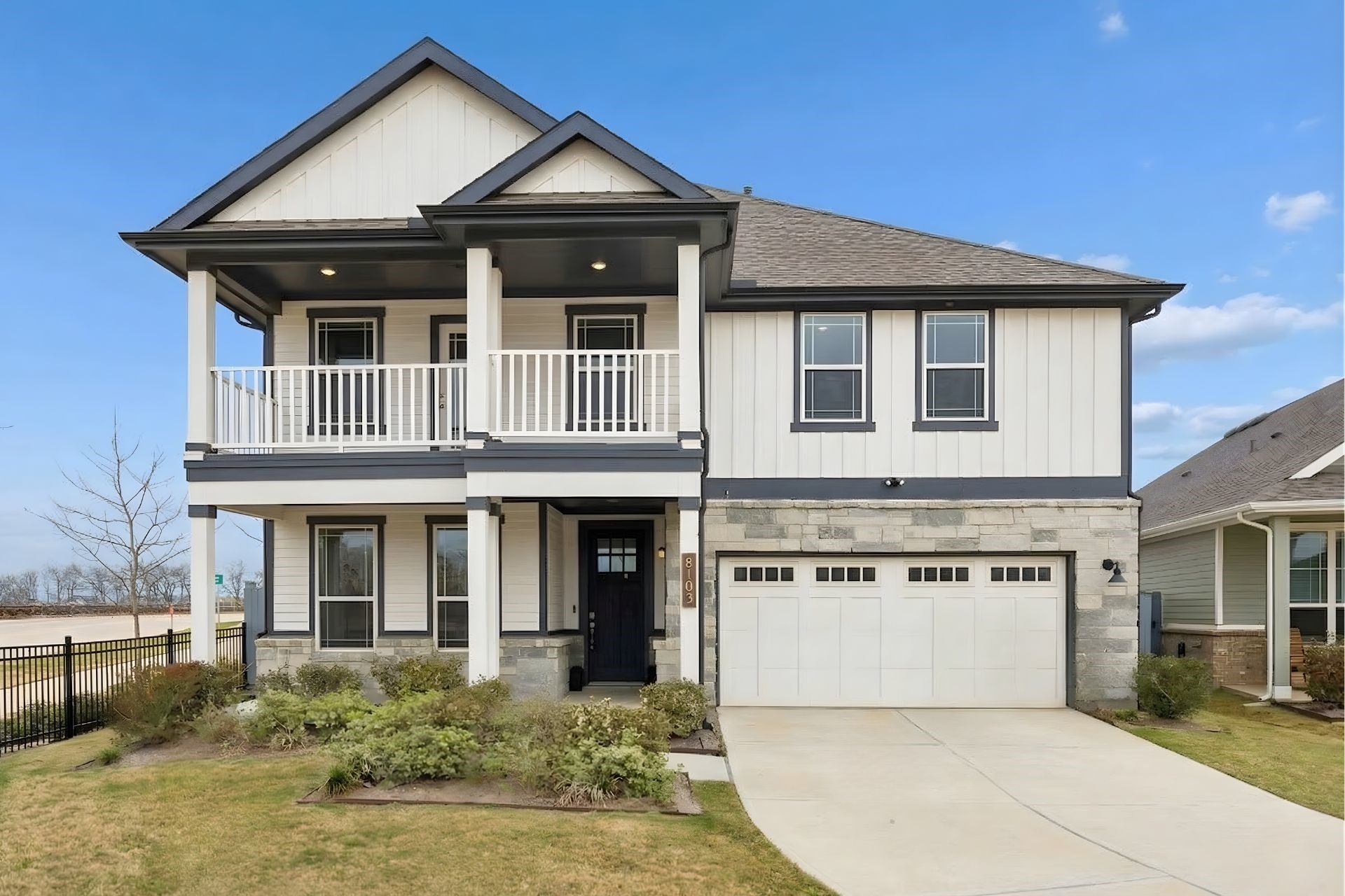 8103 Red Shiner Way Fulshear, TX 77441 - Photo 2 of 29 a front view of a house with a yard and garage