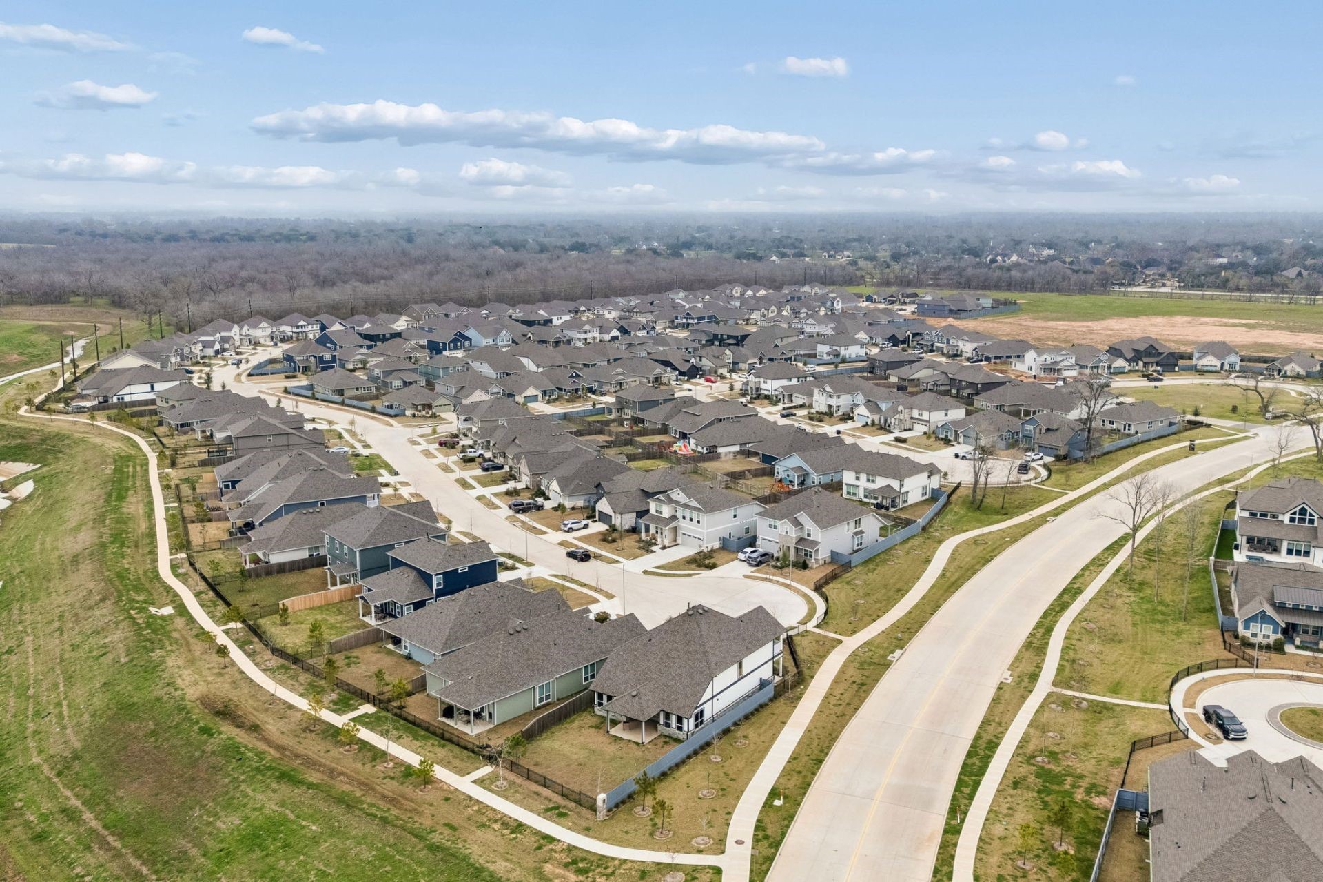 8103 Red Shiner Way Fulshear, TX 77441 - Photo 27 of 29 an aerial view of residential houses with outdoor space