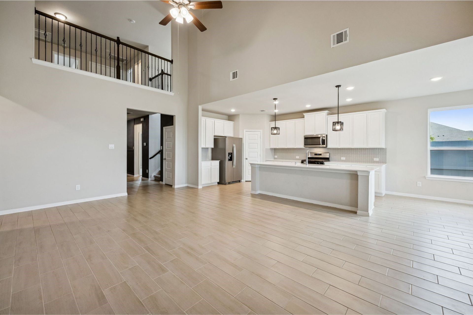 8103 Red Shiner Way Fulshear, TX 77441 - Photo 7 of 29 a view of kitchen with sink microwave and stove