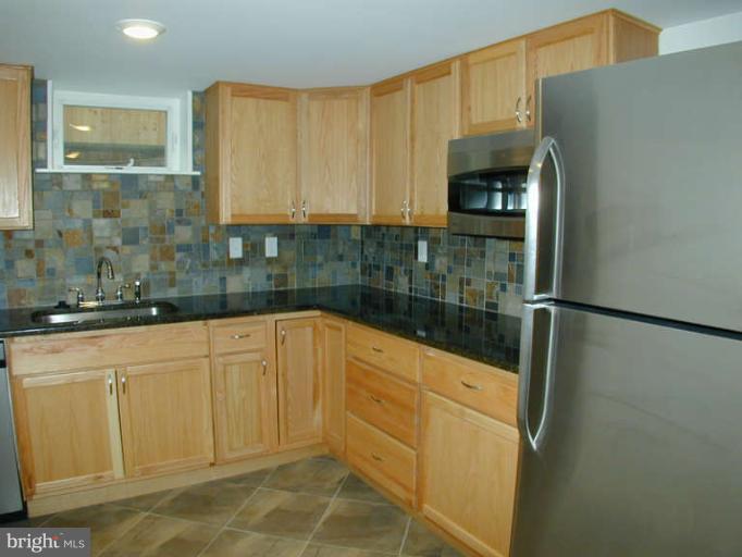 4808 Harvard Road College Park, MD 20740 - Photo 13 of 26 partial kitchen in basement