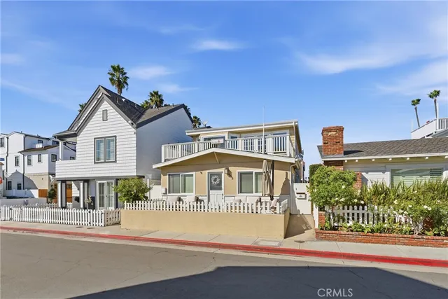 a front view of a residential apartment building with a yard