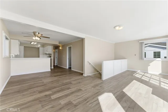 a view of a livingroom with furniture and wooden floor