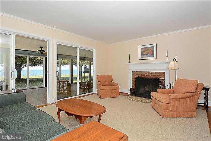 3100 Bennett Point Road Queenstown, MD 21658 - Photo 13 of 28 The living room opens to a year round sun porch
