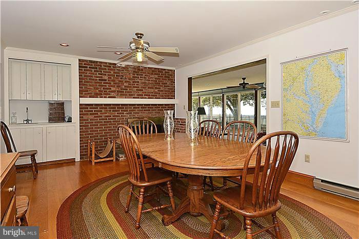 3100 Bennett Point Road Queenstown, MD 21658 - Photo 15 of 28 Fire place, open to the sun porch and kitchen