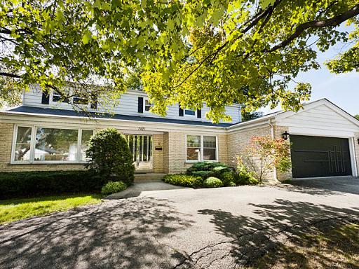 2427 Central Road Glenview, IL 60025 - Photo 1 of 14 a front view of a house with garden