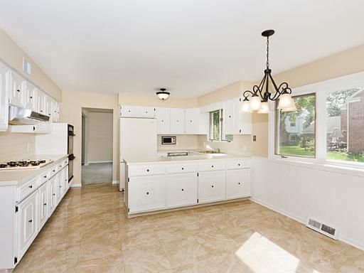 2427 Central Road Glenview, IL 60025 - Photo 4 of 14 a kitchen that has a lot of cabinets in it