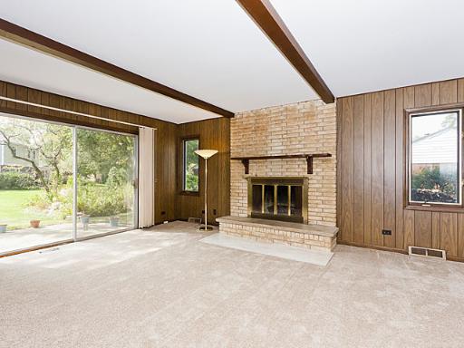 2427 Central Road Glenview, IL 60025 - Photo 6 of 14 a view of an empty room with a fireplace and a window