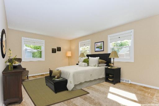 2427 Central Road Glenview, IL 60025 - Photo 9 of 14 a bedroom with a bed and wooden floor