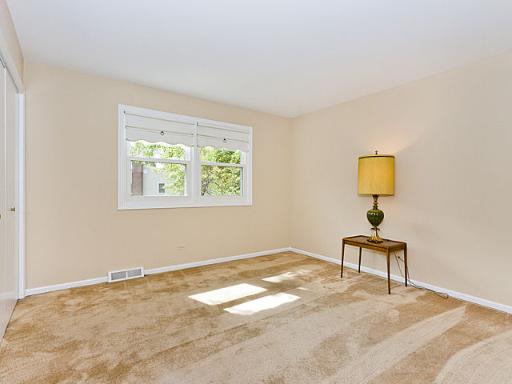 2427 Central Road Glenview, IL 60025 - Photo 10 of 14 a view of a bedroom with a bed and a window
