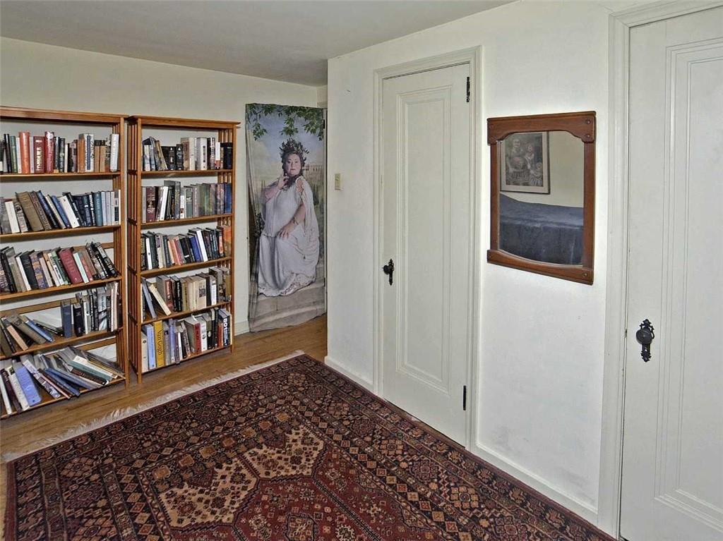 8 Holland Road Pittsburgh, PA 15235 - Photo 12 of 22 a view of a livingroom with bookshelf